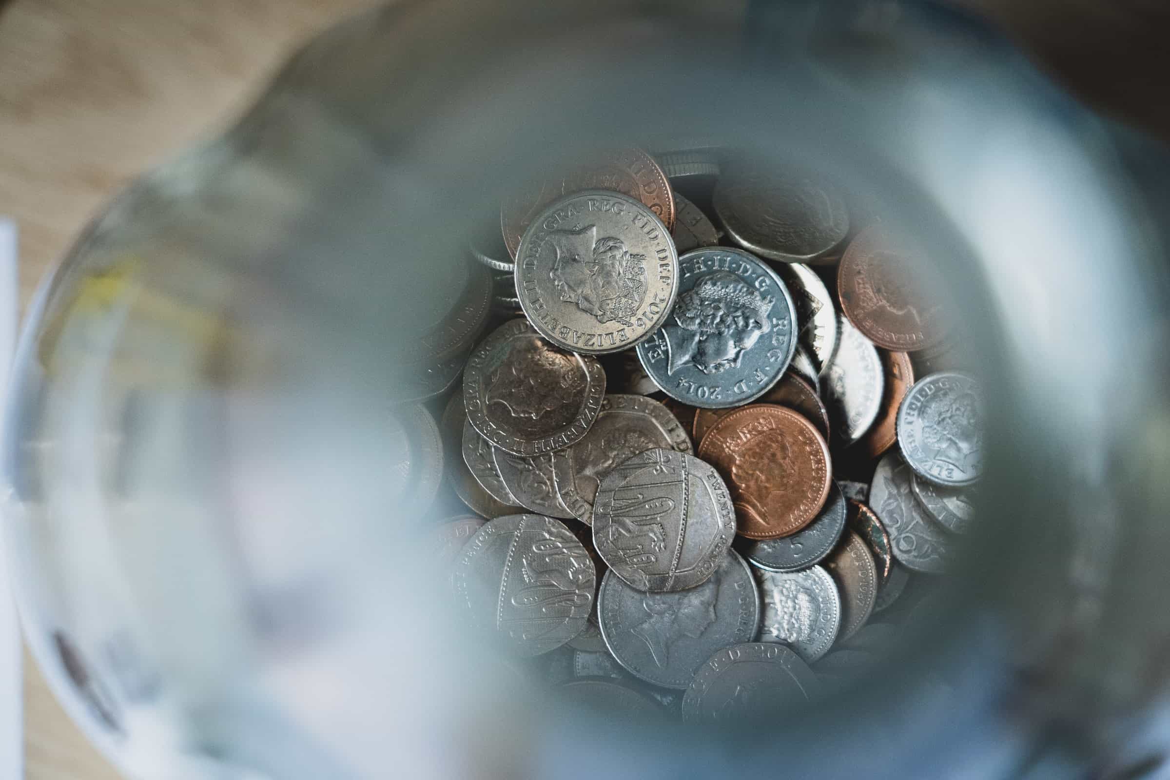 photo focused on coins in a jar for lead generation process article